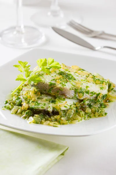 Hake served with a garlic sauce — Stock Photo, Image