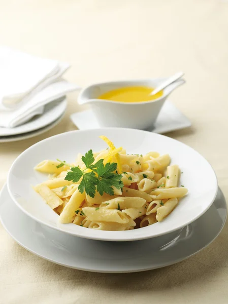 Penne pasta with butter sauce — Stock Photo, Image