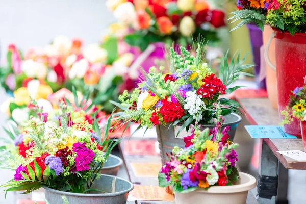 Fresh flowers for sale the open market.Blurred background.Spring, summer background.