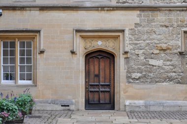 Close-up of building facade & door from Trinity College Durham Quad, Oxford, United Kingdom.