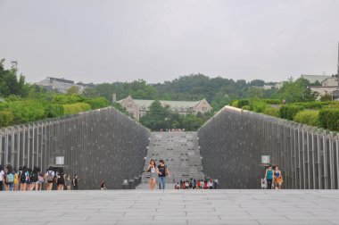 SEOUL, SOUTH KOREA - AUGUST 2012 - Ewha Womans University view of modern Campus Complex (ECC) building by french architect Dominique Perrault Architecture.