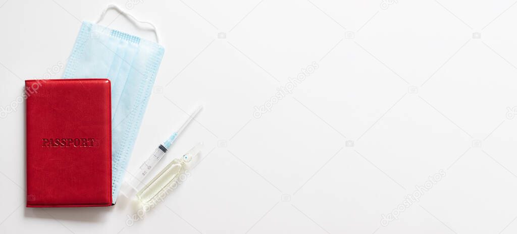 Background with a copy space. Passport, syringe, medical mask and ampoule on a white background. 
