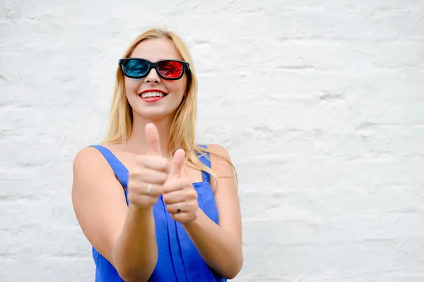 Beautiful blond girl happy pointing fingers thumbs up watching movie with 3D glasses, exciting screaming. portrait closeup — Stock Photo, Image