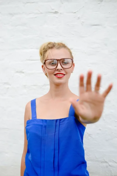 Portrait of happy beautiful blonde girl with hand in touching move, on white background closeup — Stock Photo, Image