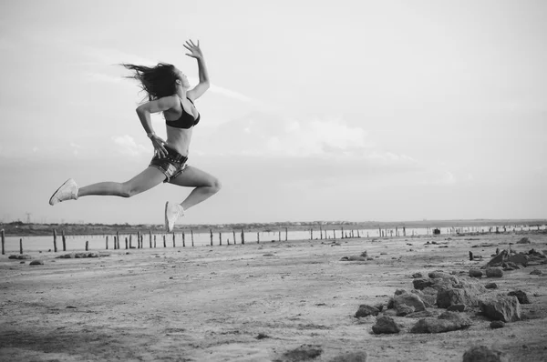 Black white photography of dance and jump, silhouette outdoors background