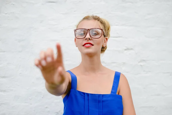 Portrait of happy beautiful blonde girl with hand in touching move, on white background closeup — Stock Photo, Image