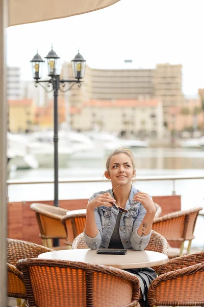 Joyful happy smiling pretty female in restaurant on luxury marina background. — Stock Photo, Image