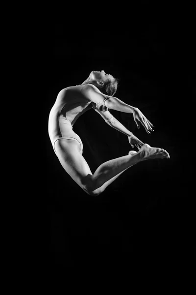 Silhouette image of beautiful girl in dancing jumping or flying — Stock Photo, Image