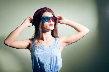 Girl in 3d glasses thoughtfully looking