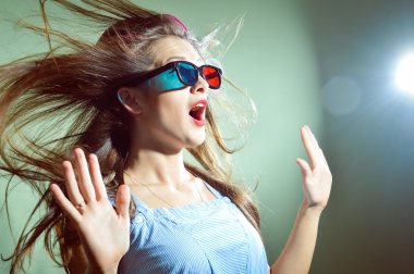 Girl in 3d glasses scared 