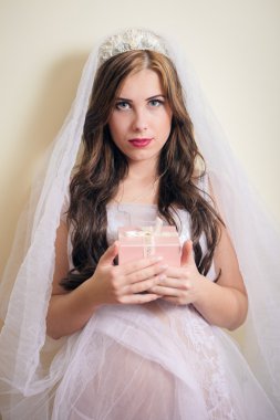 beautiful young princess holding present box