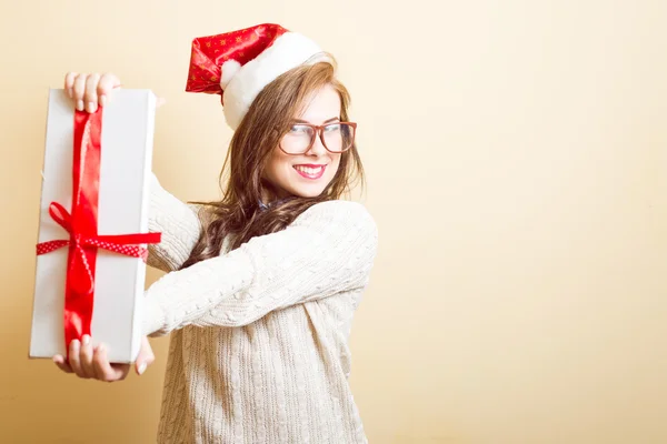 Beautiful young woman in Santa red hat and glasses — Stock Photo, Image