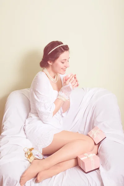 Young lady in white dress having fun holding cup of drink happy smile — Stock Photo, Image