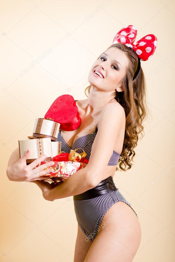 Young pretty lady having fun emotionally enjoying presents