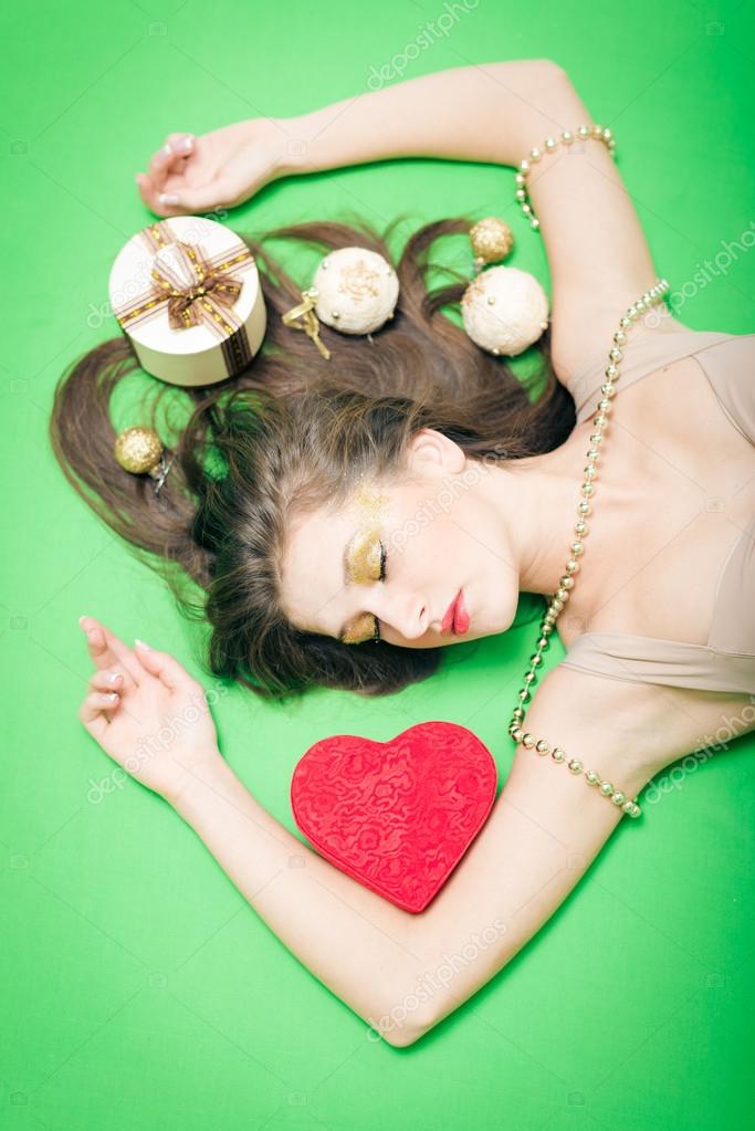 Portrait of romantic sleeping young pretty lady having fun enjoying presents relaxing lying on copy space background