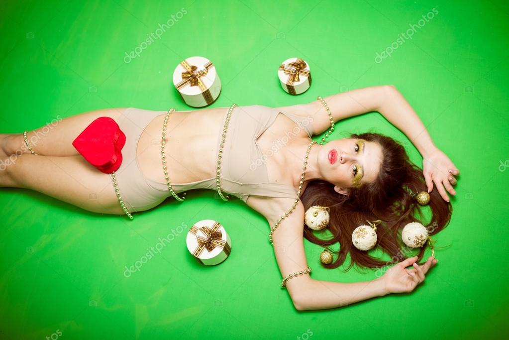 Portrait of romantic sexy young pretty woman having fun emotionally enjoying presents relaxing lying on copy space background