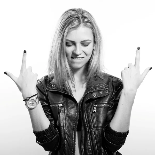 Sexy young blonde woman in leather jacket posing happy smiling over light copy space background, black and white portrait — 스톡 사진