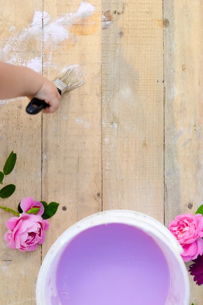 Copyspace picture of kids hand painting wooden board — Stock Photo, Image