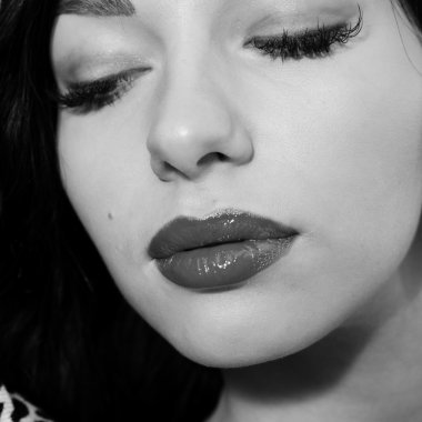 Black and white photography closeup portrait of beautiful sexy young lady relaxing eyes closed
