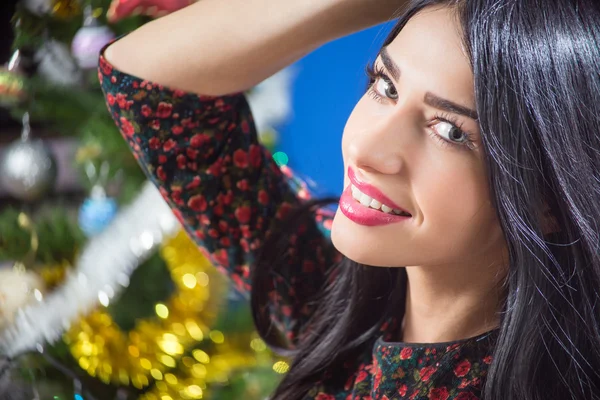 Charming woman happy smiling on blurred Christmas tree indoor background. — Φωτογραφία Αρχείου