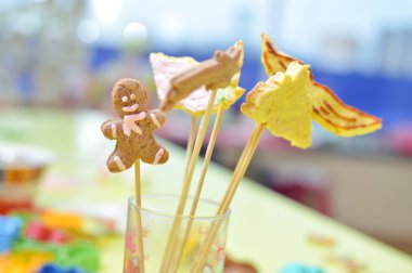 Image of handmade cookies on stick in glass