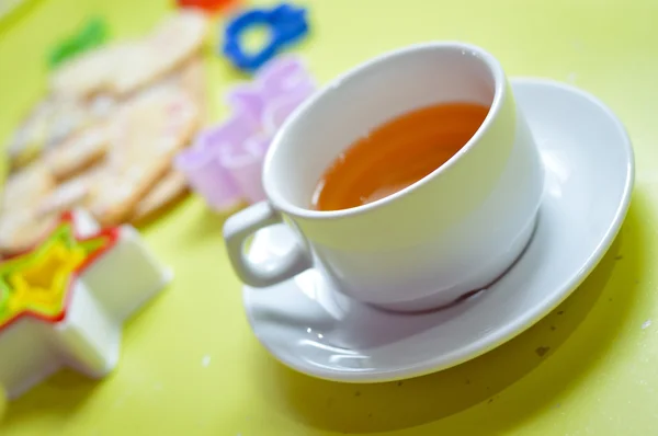 Picture of tea tasty cookies molds over light table — Stock Photo, Image