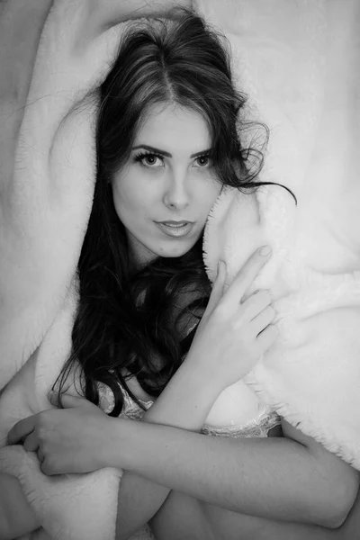 Sexually hot young beautiful lady in lingerie relaxing in bed and looking at camera seductive, black and white portrait — Zdjęcie stockowe