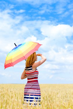 Image of elegant romantic woman having fun holding up umbrella on blue sky copy space background outdoors