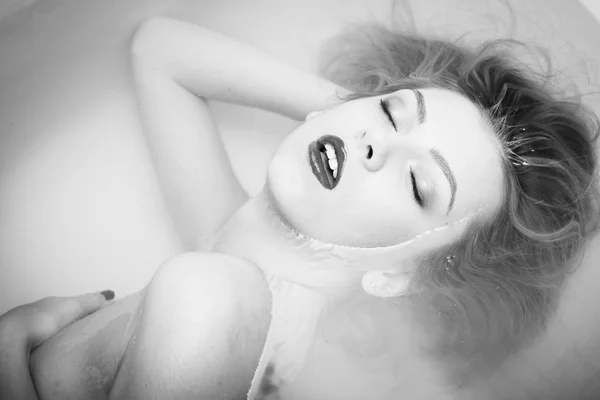 Picture closeup on eyes closed elegant young lady with mouth open in pleasure having fun happy relaxing laying in clear water — 스톡 사진