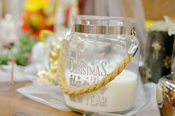 Beautiful big white candle in glass box with rope handle — Stock Photo, Image