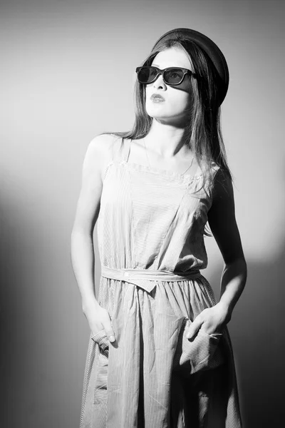 Portrait of exciting beautiful young lady in 3d glasses looking up. Black and white image — Stock Photo, Image