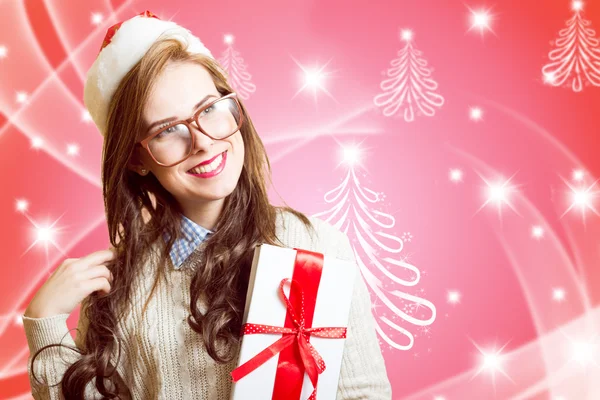 Portrait of beautiful young lady in Santa red hat and glasses holding gift box — Stok fotoğraf