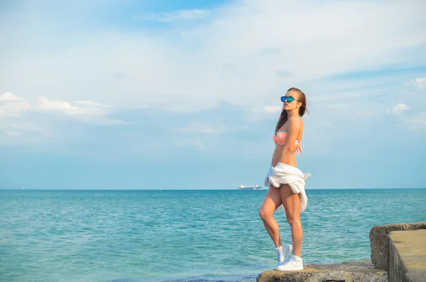 Picture of beautiful young woman having fun enjoying sunshine posing over water on outdoors background copy space — Stock Photo, Image