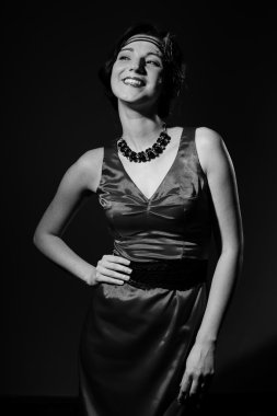 portrait of beautiful young lady in dress having fun happy smile and looking at camera on copy space background