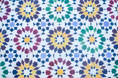 Beautiful colorful Moroccan mosaic pattern resembling flowers on white background