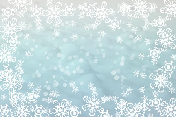 Beautiful white snowflakes framing frozen window on blue winter background — Stok fotoğraf