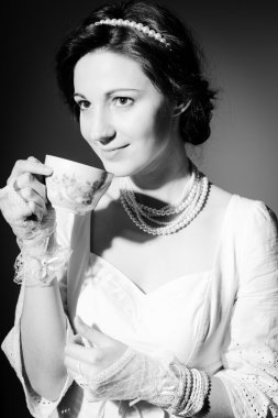 Black and white photography of drinking tea or coffee beautiful young lady happy smile on copy space background