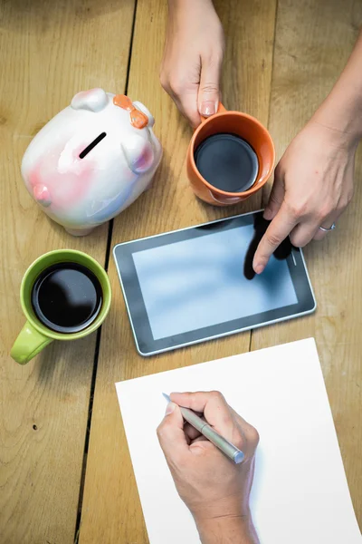 Closeup of budget planning with two cups of coffee — Stockfoto