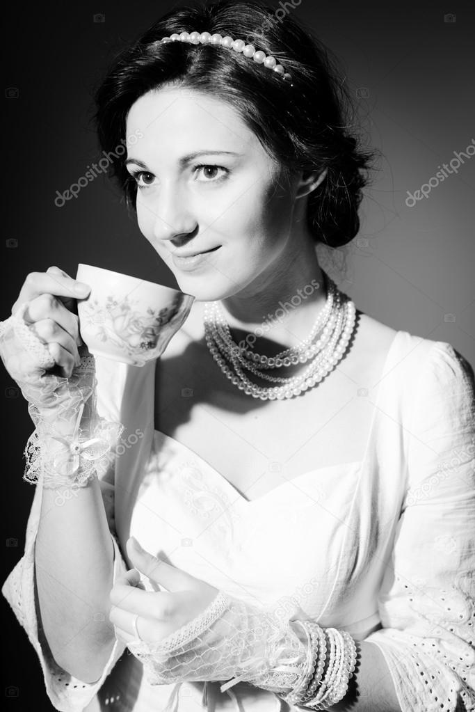 Black and white photography of drinking tea or coffee beautiful young lady happy smile on copy space background