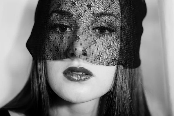 Closeup of beautiful woman in black veiling. Black and white portrait — Zdjęcie stockowe