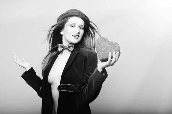 Picture of romantic beautiful girl with present box in the form of heart — Stock fotografie