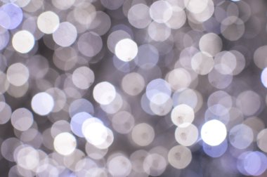 Işık arka plan beyaz bokeh ışıkları ile bulanık. Şenlikli tatil tema ile boşaltmak