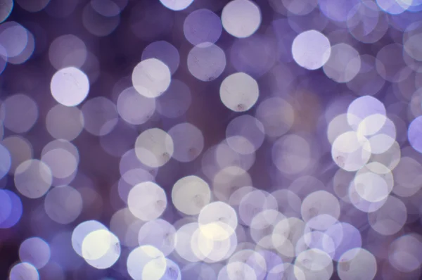 Light blurred background with white bokeh lights on it. Festive holiday theme with copyspace — Stock Photo, Image