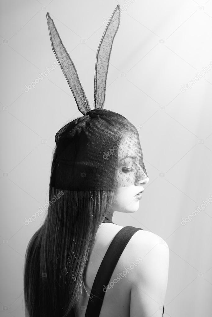 Portrait of sexy mysterious young pretty lady in bunny ears mask