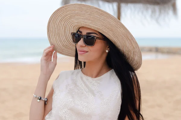 Elegant young beautiful lady lying on sandy beach. vacation concept — Stock Photo, Image