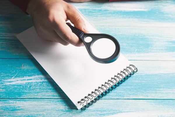 Sitting Magnifying Glass Looking Notebook — Stock Photo, Image