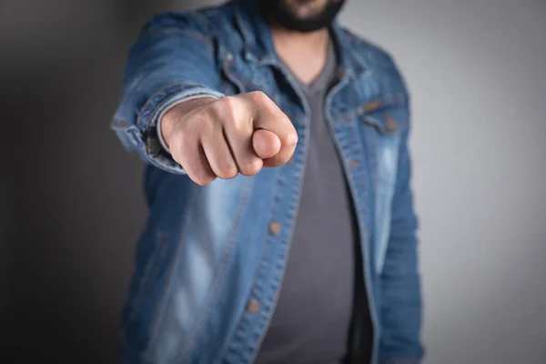 young man showing fingers rude gestur