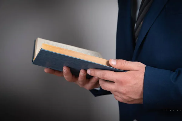 stock image young businessman reading a book