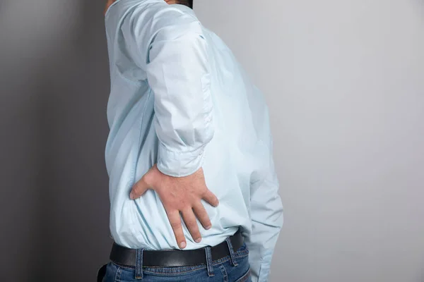 Man Has Kidney Pain Gray Background — Stock Photo, Image