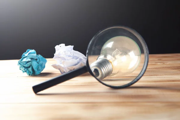 Concept Study Lamp Crumpled Papers Magnifying Glass Table — Stock Photo, Image